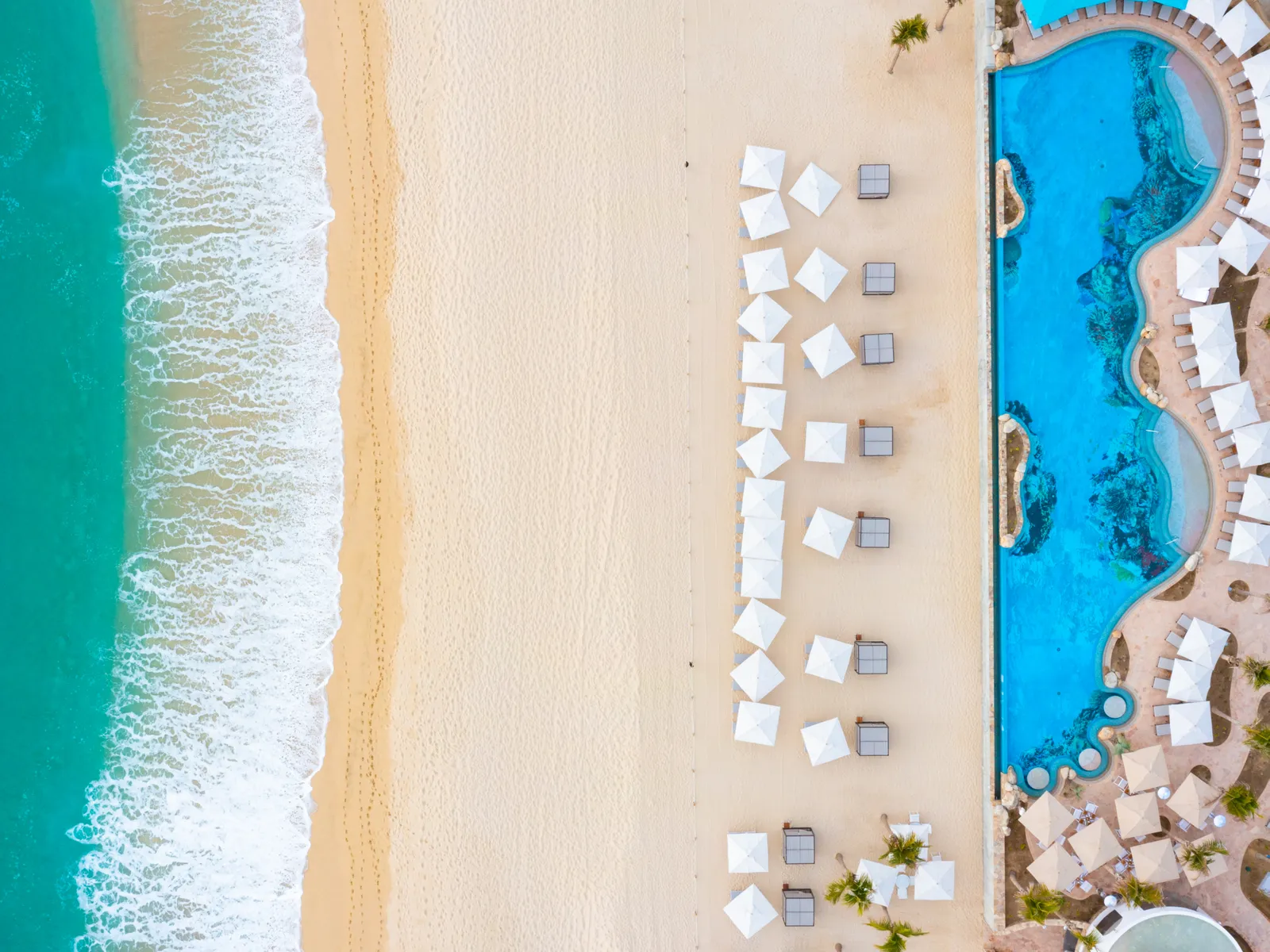 Beach cabanas with white umbrella