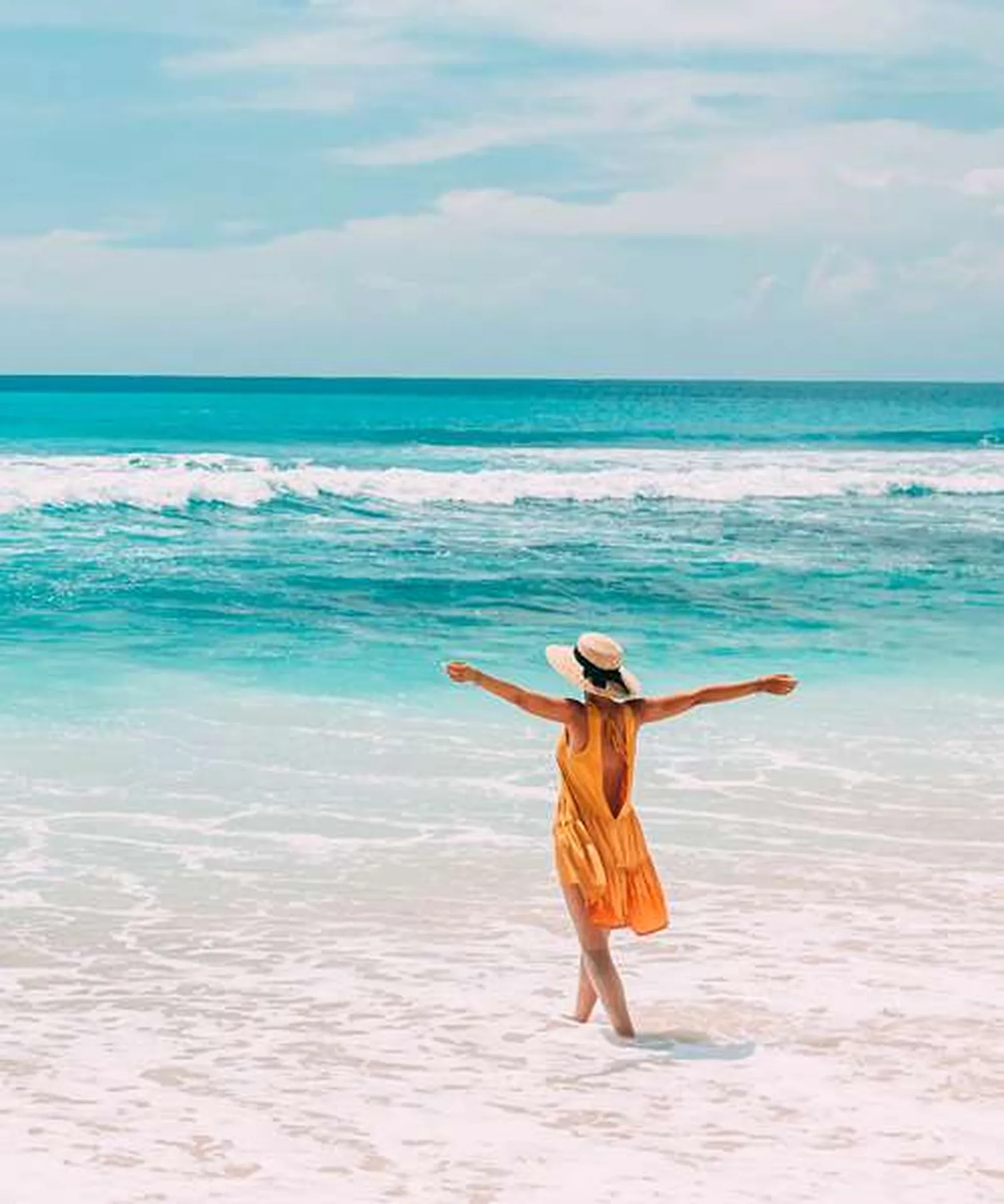 A person walking along the beach